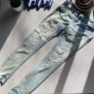 Skinny, ripped, denim jeans.